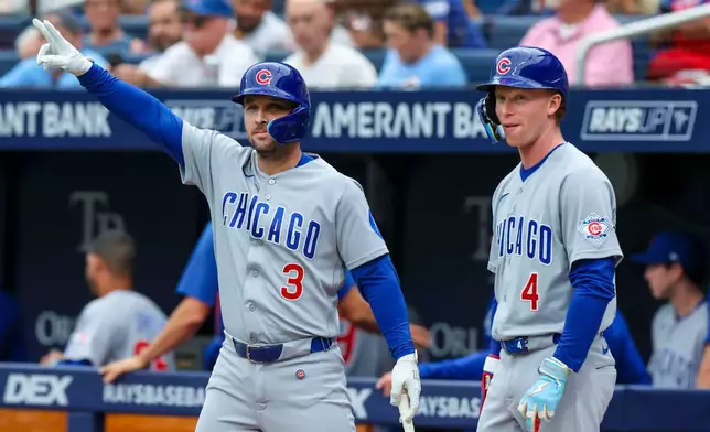 Chicago Cubs designated hitter Alex Bregman (3) and Pete Crow-Armstrong (4) stand in the on-deck circle before a baseball game against the Boston Red Sox, Sunday, Sept. 27, 2026, in St. Petersburg, Fla. (AP Photo/Chris Urso)