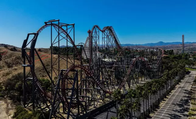 This aerial view shows the X2 roller coaster at Six Flags Magic Mountain in Valencia, Calif., Wednesday, Sept. 23, 2026. (AP Photo/Jae C. Hong)