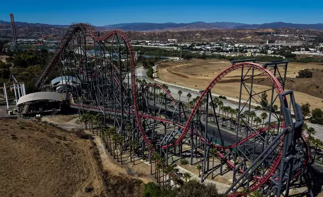 This aerial view shows the X2 roller coaster at Six Flags Magic Mountain in Valencia, Calif., Wednesday, Sept. 23, 2026. (AP Photo/Jae C. Hong)