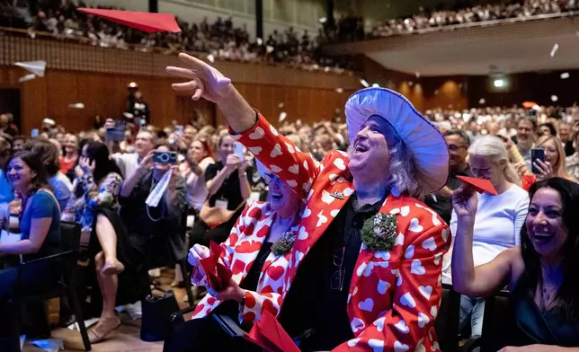 Spectators throw paper planes during the Ig Nobel Prize ceremony held in the Zurich Convention Center in Zurich, Switzerland, on Thursday, Sept. 3, 2026. (Claudio Thoma/Keystone via AP)