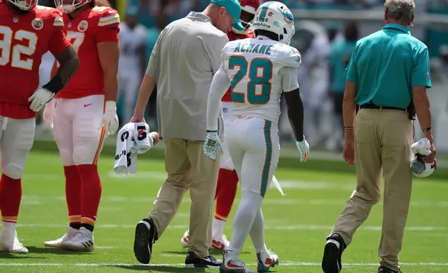 Miami Dolphins running back De'von Achane (28) walks off the field after an injury during the first half of an NFL football game against the Kansas City Chiefs in Miami Gardens, Fla., Sunday, Sept. 27, 2026. (AP Photo/Lynne Sladky)