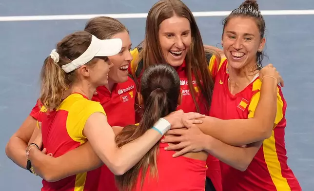 Spain's team members celebrate after defeating Kazakhstan in a quarterfinal match for the Billie Jean King Cup held in Shenzhen in southern China's Guangdong province, Wednesday, Sept. 23, 2026. (AP Photo/Andy Wong)