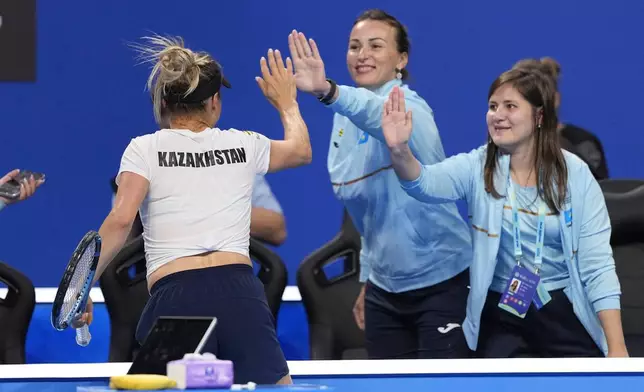 Kazakhstan's Yulia Putintseva celebrates after defeating Spain's Cristina Bucsa during a quarterfinal match for the Billie Jean King Cup held in Shenzhen in southern China's Guangdong province, Wednesday, Sept. 23, 2026. (AP Photo/Andy Wong)