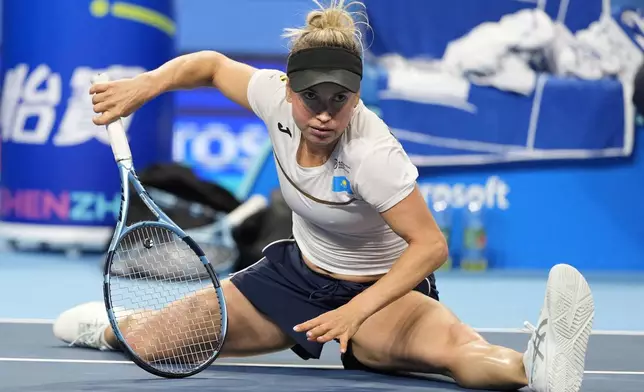 Kazakhstan's Yulia Putintseva falls during play against Spain's Cristina Bucsa in a quarterfinal match for the Billie Jean King Cup held in Shenzhen in southern China's Guangdong province, Wednesday, Sept. 23, 2026. (AP Photo/Andy Wong)