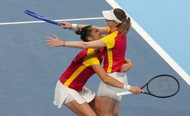 Spain's Cristina Bucsa and Sara Sorribes Tormo celebrates after defeating Kazakhstan's Anna Danilina and Zhibek Kulambayeva in a quarterfinal match for the Billie Jean King Cup held in Shenzhen in southern China's Guangdong province, Wednesday, Sept. 23, 2026. (AP Photo/Andy Wong)