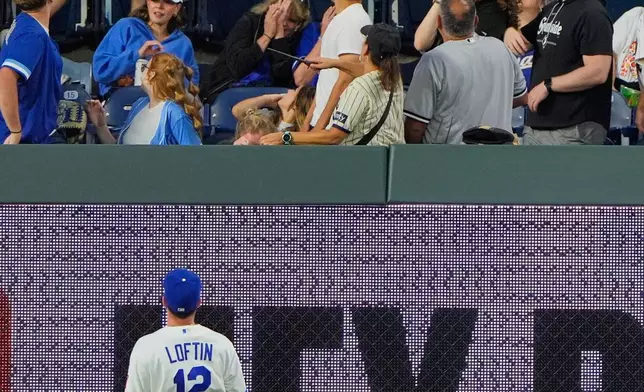 Kansas City Royals left fielder Nick Loftin watches a three-run home run hit by Chase Meidroth during the third inning of a baseball game Tuesday, Sept. 22, 2026, in Kansas City, Mo. (AP Photo/Charlie Riedel)