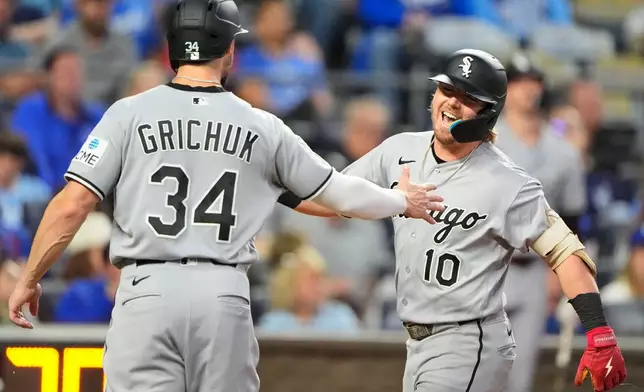 Chicago White Sox's Chase Meidroth (10) celebrates with Randal Grichuk after hitting a three-run home run during the third inning of a baseball game against the Kansas City Royals, Tuesday, Sept. 22, 2026, in Kansas City, Mo. (AP Photo/Charlie Riedel)