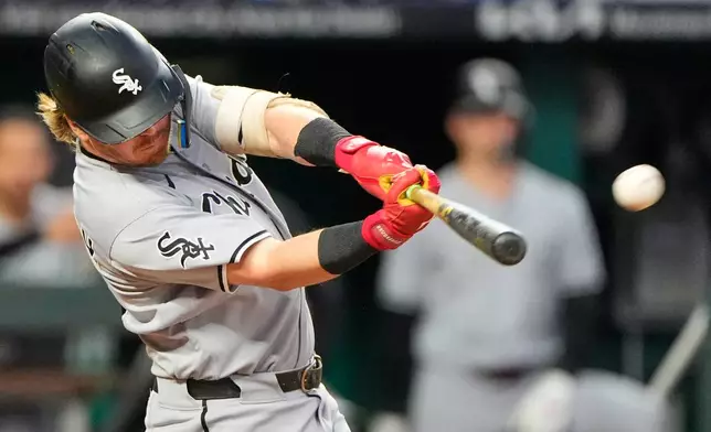 Chicago White Sox's Chase Meidroth hits a three-run home run during the third inning of a baseball game against the Kansas City Royals, Tuesday, Sept. 22, 2026, in Kansas City, Mo. (AP Photo/Charlie Riedel)