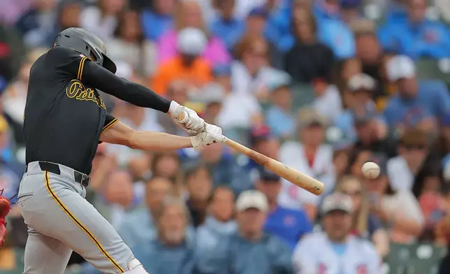 Pittsburgh Pirates' Brandon Lowe hits a two-RBI single during the sixth inning of a baseball game against the Chicago Cubs, Sunday, Sept. 13, 2026, in Chicago. (AP Photo/Melissa Tamez)