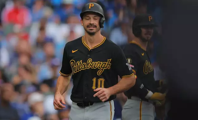 Pittsburgh Pirates' Bryan Reynolds scores on an RBI double hit by Nick Gonzales during the sixth inning of a baseball game against the Chicago Cubs, Sunday, Sept. 13, 2026, in Chicago. (AP Photo/Melissa Tamez)