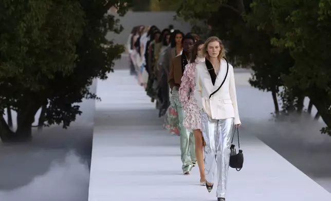 Models wear creations as part of the Christian Dior Womenswear Spring Summer 2027 collection presented in Paris, France, Tuesday, Sept. 29, 2026. (AP Photo/Thomas Padilla)