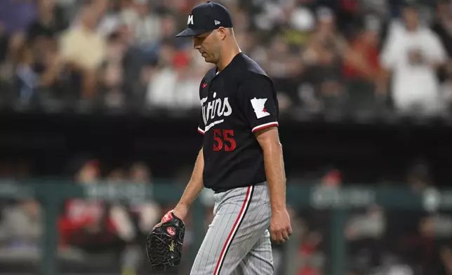 Minnesota Twins relief pitcher Taylor Rogers reacts after being pulled during the seventh inning of a baseball game against the Chicago White Sox Friday, Sept. 4, 2026, in Chicago. (AP Photo/Paul Beaty)