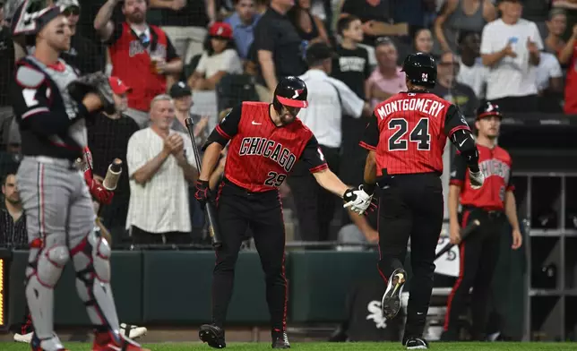 Chicago White Sox's Braden Montgomery (24) celebrates with teammate Tristan Peters (29) after hitting a solo home run during the second inning of a baseball game against the Minnesota Twins, Friday, Sept. 4, 2026, in Chicago. (AP Photo/Paul Beaty)