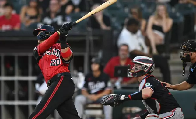 Chicago White Sox's Miguel Vargas watches his solo home run during the first inning of a baseball game against the Minnesota Twins Friday, Sept. 4, 2026 in Chicago. (AP Photo/Paul Beaty)