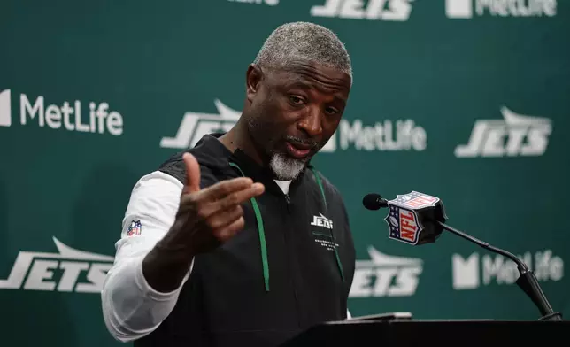 New York Jets head coach Aaron Glenn speaks during a news conference following an NFL football game against the Green Bay Packers in East Rutherford, N.J., Sunday, Sept. 20, 2026. (AP Photo/Adam Hunger)