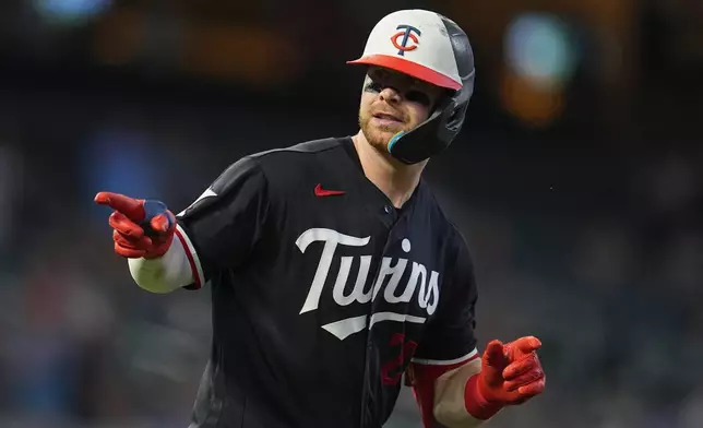 Minnesota Twins' Ryan Jeffers runs the bases after hitting a three-run home run during the fifth inning of a baseball game against the Detroit Tigers, Monday, Aug. 31, 2026, in Minneapolis. (AP Photo/Abbie Parr)