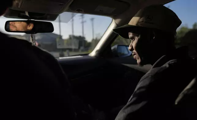 Samba Diallo, right, a Mauritanian immigrant, is driven by Vincent Wilson, following Diallo’s Immigration and Customs Enforcement appointment in Cincinnati, Monday, Sept. 14, 2026. (AP Photo Carolyn Kaster)