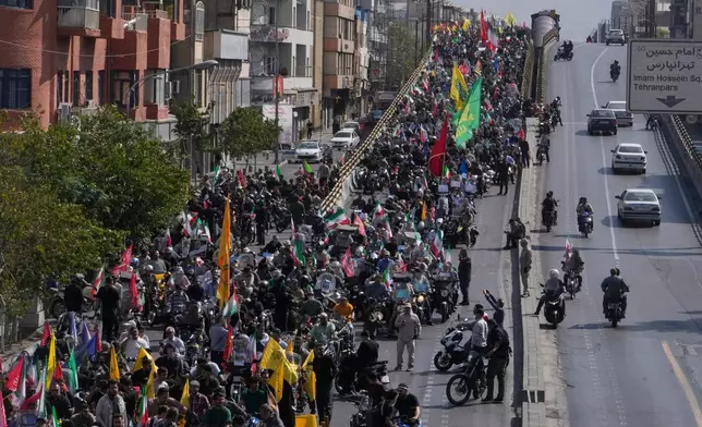 Motorcyclists ride during a state-organized motorcycle parade called "Janfada," meaning "Sacrifice for Iran,", in Tehran, Iran, Friday, Sept. 25, 2026. (AP Photo/Vahid Salemi)