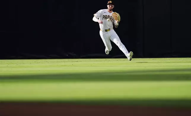 San Diego Padres center fielder Jackson Merrill tracks down a hit for a single by New York Yankees' Spencer Jones during the third inning of a baseball game Saturday, Sept. 5, 2026, in San Diego. (AP Photo/Gregory Bull)
