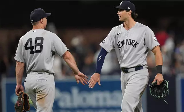 New York Yankees right fielder Spencer Jones, right, celebrates with first baseman Paul Goldschmidt after the Yankees defeated the San Diego Padres 5-1 in a baseball game Saturday, Sept. 5, 2026, in San Diego. (AP Photo/Gregory Bull)