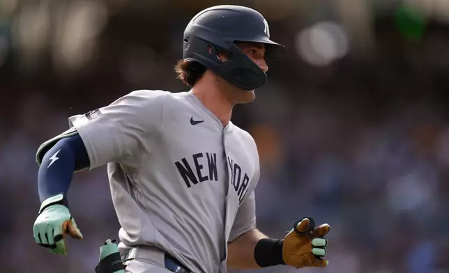 New York Yankees' Spencer Jones runs after hitting an RBI double during the second inning of a baseball game against the San Diego Padres Saturday, Sept. 5, 2026, in San Diego. (AP Photo/Gregory Bull)