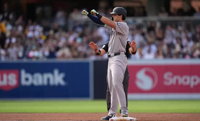 New York Yankees' Spencer Jones celebrates after hitting an RBI double during the second inning of a baseball game against the San Diego Padres Saturday, Sept. 5, 2026, in San Diego. (AP Photo/Gregory Bull)
