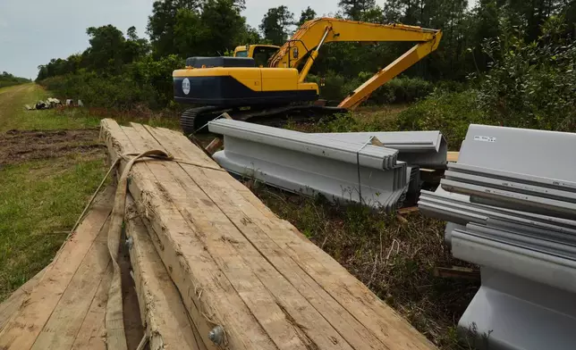 Construction materials sit near a peatland restoration site Wednesday, May 6, 2026, in Belhaven, N.C. (AP Photo/Joshua A. Bickel)
