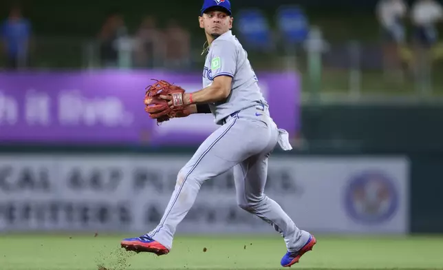 Toronto Blue Jays shortstop Andrés Giménez fields a ground ball off the bat of Athletics' Alika Williams, not shown, before throwing to first base for the out during the fifth inning of a baseball game Tuesday, Sept. 8, 2026, in West Sacramento, Calif. (AP Photo/Scott Marshall)