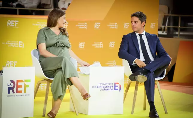 FILE - French Green Party leader Marine Tondelier, left, and Former French Prime minister Gabriel Attal, candidates at presidential election attends the business meeting organized by the French business organization (MEDEF) in Paris, Thursday, Aug. 27, 2026. (AP Photo/Thomas Padilla, File)