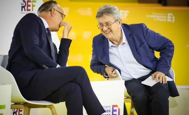 FILE - Former French Prime Minister and head of Horizons political party Edouard Philippe and French far-left leader Jean-Luc Melenchon, right, candidates at presidential election attend the business meeting organized by the French business organization (MEDEF) in Paris, Thursday, Aug. 27, 2026. (AP Photo/Thomas Padilla, File)