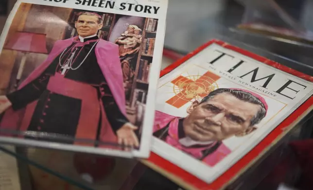 Artifacts and memorabilia depicting the late Archbishop Fulton Sheen are displayed in the Sheen Museum on July 15, 2026, in Peoria, Ill. (AP Photo/Jessie Wardarski)