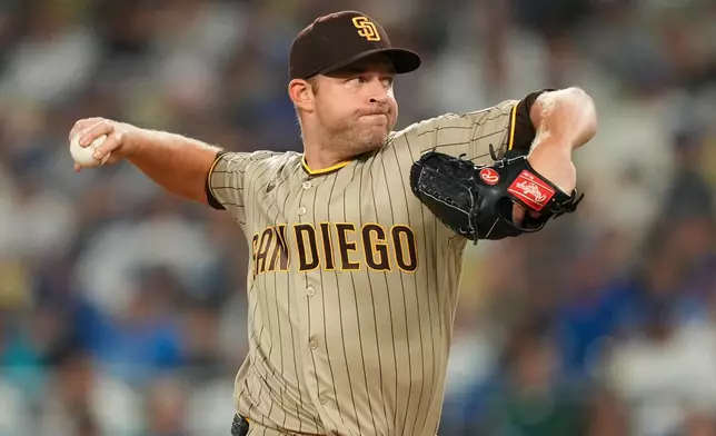 San Diego Padres starting pitcher Michael King throws to the plate during the first inning of a baseball game against the Los Angeles Dodgers, Tuesday, Sept. 22, 2026, in Los Angeles. (AP Photo/Mark J. Terrill)