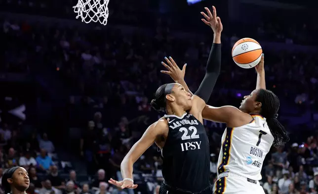 Indiana Fever center Aliyah Boston (7) goes to the basket against Las Vegas Aces center A'ja Wilson (22) during the first half in Game 1 of an WNBA basketball first-round playoff series Sunday, Sept. 27, 2026, in Las Vegas. (AP Photo/Steve Marcus)