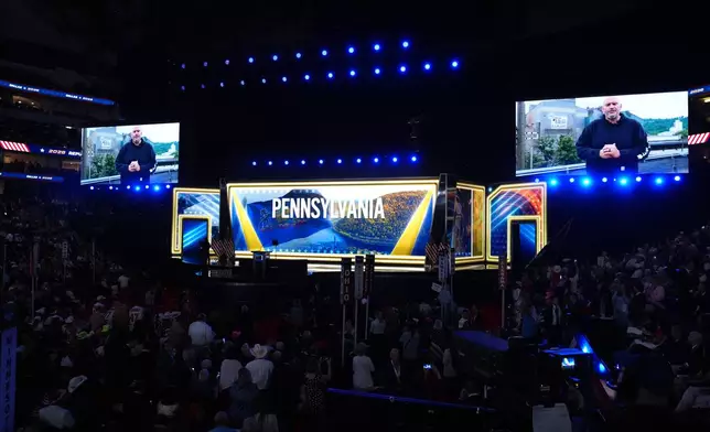 A video featuring Sen. John Fetterman, D-Pa., plays at the Republican convention Wednesday, Sept. 9, 2026, in Dallas. (AP Photo/Alex Brandon)