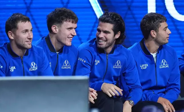 Team Europe's Casper Ruud, Jakub Mensik, Carlos Alcaraz and Flavio Cobolli, from left, react as they watch Alexander Zverev play Team World's Learner Tien during a Laver Cup tennis tournament match in London, Sunday, Sept. 27, 2026. (AP Photo/Maja Smiejkowska)
