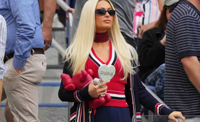 Paris Hilton attends a match between Elena Rybakina, of Kazakhstan, and Aryna Sabalenka, of Belarus, during the women's singles final of the U.S. Open tennis championships Saturday, Sept. 12, 2026, in New York. (AP Photo/Kirsty Wigglesworth)