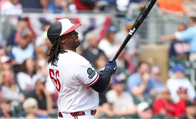 Minnesota Twins designated hitter Josh Bell hits a sacrifice fly against the Texas Rangers during the first inning of a baseball game, Sunday, Sept. 27, 2026, in Minneapolis. (AP Photo/Matt Krohn)