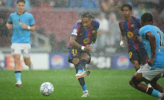 Barcelona's Raphinha scores the opening goal of his team during the Champions League opening phase soccer between Barcelona and Feyenoord in Barcelona, Spain, Wednesday, Sept. 9, 2026.(AP Photo/Emilio Morenatti)