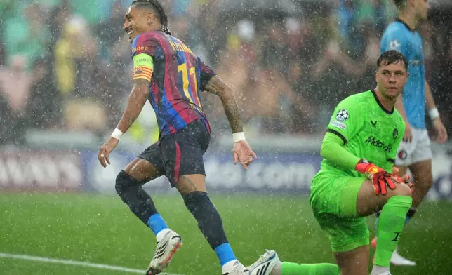 Barcelona's Raphinha celebrates after scoring the opening goal of his team during the Champions League opening phase soccer between Barcelona and Feyenoord in Barcelona, Spain, Wednesday, Sept. 9, 2026.(AP Photo/Emilio Morenatti)