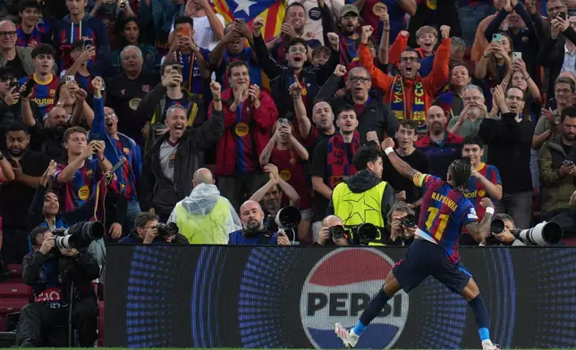 Barcelona's Raphinha celebrates after scoring his side's third goal during the Champions League opening phase soccer between Barcelona and Feyenoord in Barcelona, Spain, Wednesday, Sept. 9, 2026.(AP Photo/Emilio Morenatti)