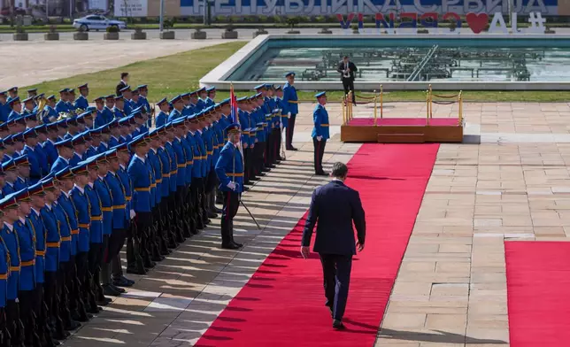 FILE - Serbian President Aleksandar Vucic walks on the red carpet before a welcoming ceremony for Burundi President Evariste Ndayishimiye at the Serbia Palace in Belgrade, Serbia, March 12, 2025. (AP Photo/Darko Vojinovic, File)