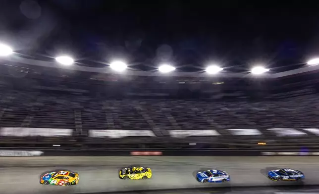 Ty Gibbs (54) leads Carson Hocevar (77), Kyle Larson (5), and Ryan Blaney (12) during a NASCAR Cup Series auto race Saturday, Sept. 19, 2026, in Bristol, Tenn. (AP Photo/Wade Payne)