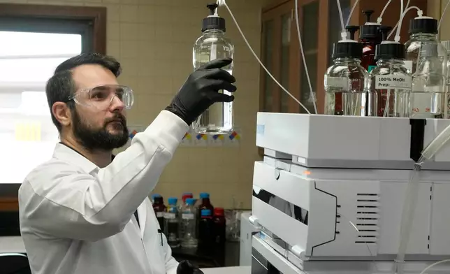 Michael Serpa, senior scientist at the Scottsdale Water Campus, works on water testing, Wednesday, Sept. 9, 2026, in Scottsdale, Ariz. (AP Photo/Ross D. Franklin)