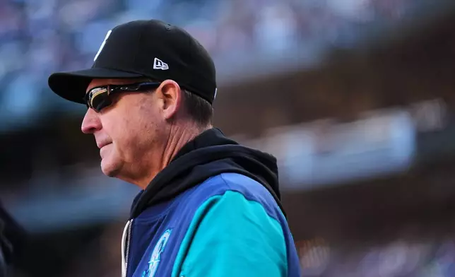 Seattle Mariners manager Dan Wilson looks on during the second inning of a baseball game against the Los Angeles Angels, Sunday, Sept. 27, 2026, in Seattle. (AP Photo/Lindsey Wasson)