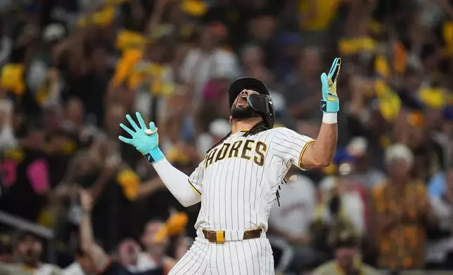San Diego Padres right fielder Fernando Tatis Jr. celebrates his home run in the first inning of Game 1 of the National League Wild Card baseball playoff series against the Chicago Cubs Tuesday, Sept. 29, 2026, in San Diego. (AP Photo/Gregory Bull)