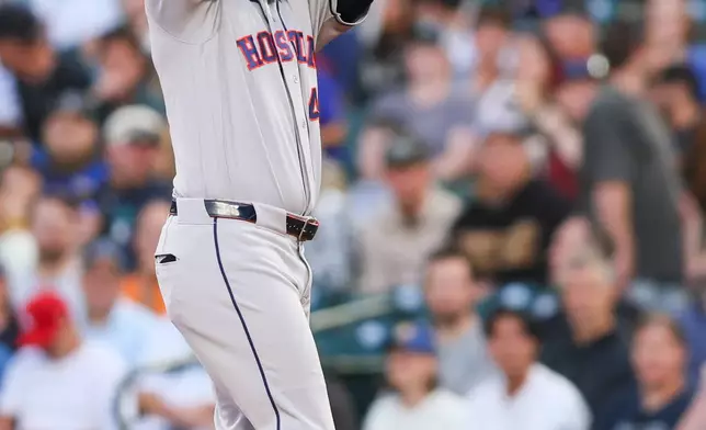 Houston Astros designated hitter Yordan Alvarez (44) reacts after hitting a RBI single in the first inning of a baseball game against the Seattle Mariners, Tuesday, Sept. 22, 2026, in Seattle. (AP Photo/Kevin Ng)