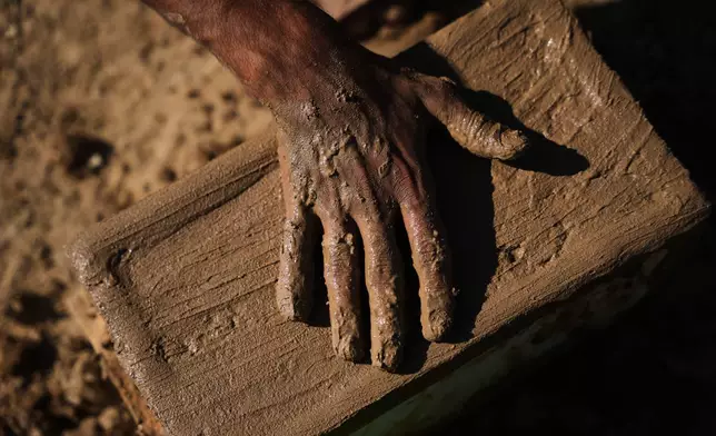 Khalil Abu Ramadan, 26, makes clay bricks for building amid a shortage of construction materials in the Gaza Strip, in the Maghazi refugee camp, central Gaza Strip, Thursday, Sept. 3, 2026. (AP Photo/Abdel Kareem Hana)