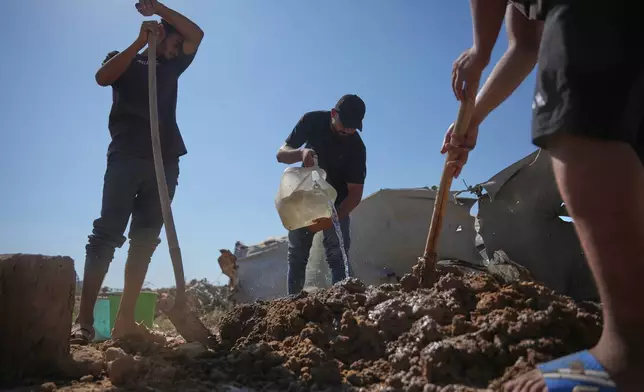 Palestinians make clay bricks for building amid a shortage of construction materials in the Gaza Strip, in the Maghazi refugee camp, central Gaza Strip, Thursday, Sept. 3, 2026. (AP Photo/Abdel Kareem Hana)