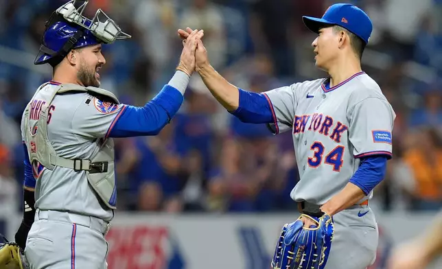 New York Mets pitcher Kodai Senga celebrates with catcher Luis Torrens after closing out the Tampa Bay Rays during the ninth inning of a baseball game Monday, Aug. 31, 2026, in St. Petersburg, Fla. (AP Photo/Chris O'Meara)