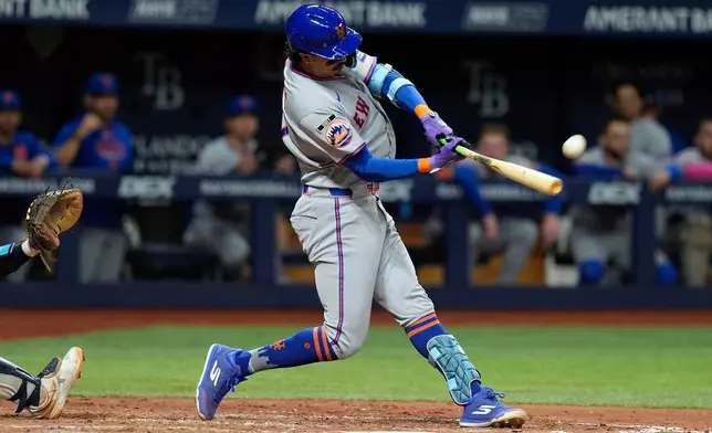 New York Mets' Mark Vientos connects for a home run off Tampa Bay Rays pitcher Ian Seymour during the seventh inning of a baseball game Monday, Aug. 31, 2026, in St. Petersburg, Fla. (AP Photo/Chris O'Meara)